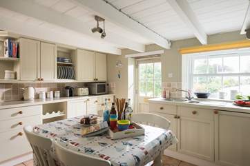 The country cottage kitchen with the door opening to the front and onto the driveway and garden.
