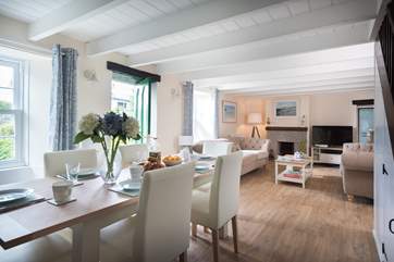 The spacious open plan sitting/dining-room.