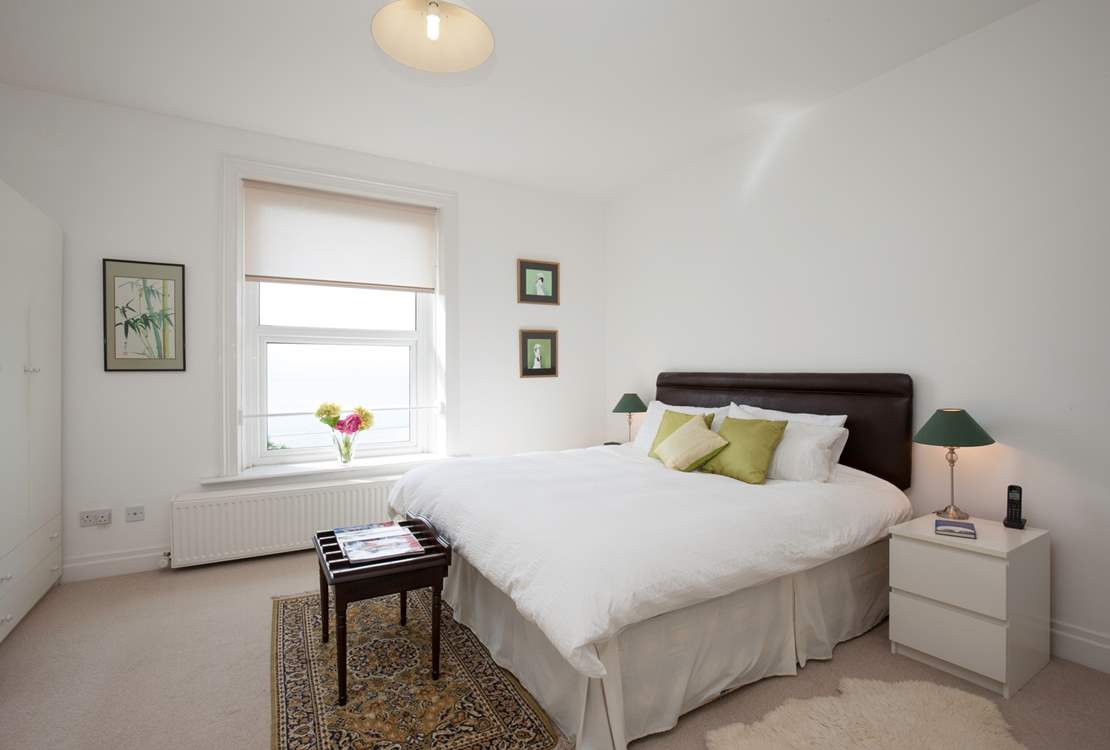 The main bedroom has a super-king bed. Sit up with your morning coffee and admire the views.