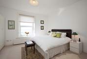 The main bedroom has a super-king bed. Sit up with your morning coffee and admire the views.