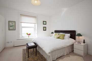 The master bedroom has a super-king bed. Sit up with your morning coffee and admire the views.