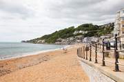 Ventnor seafront with the family-friendly Spyglass Inn at the end with fabulous patio seating.