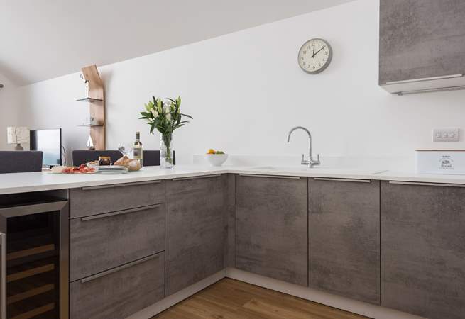 A fabulous kitchen with everything you need including a wine fridge!