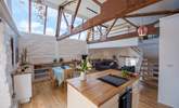 The kitchen island looking to the living area (the galleried bedroom is at the far right of the picture). - Thumbnail Image