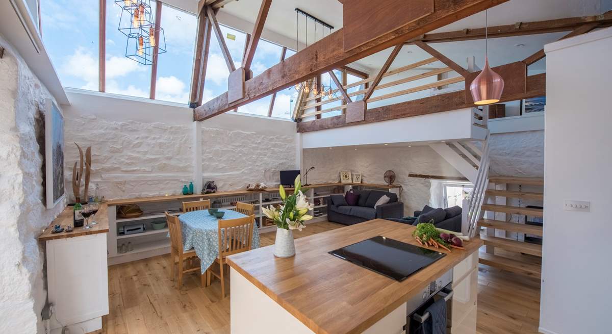 The kitchen island looking to the living area (the galleried bedroom is at the far right of the picture).