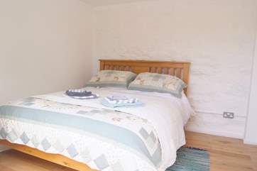 The ground floor double bedroom with a king size bed.