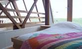 The galleried bedroom on the first floor has a 4' single bed and spectacular countryside views. - Thumbnail Image