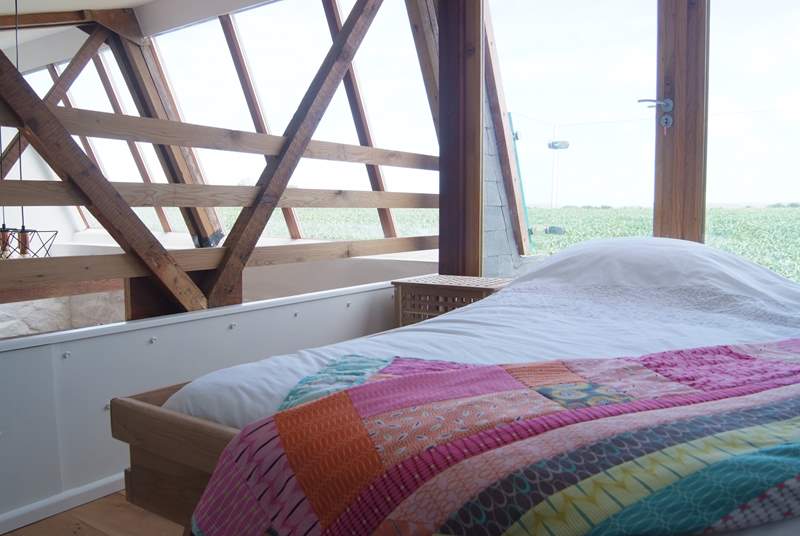 The galleried bedroom on the first floor has a 4' single bed and spectacular countryside views.