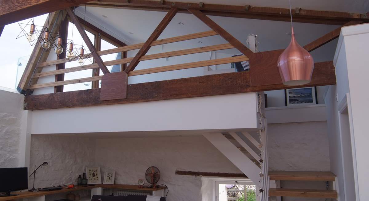 There are open tread stairs up to the galleried bedroom.  This overlooks the ground floor living-area.