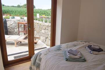 The ground floor double bedroom has doors to the terrace.