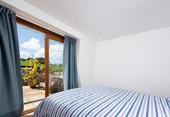 The ground floor bedroom has doors to the terrace.