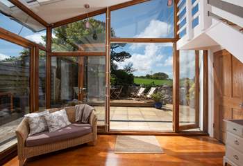 Floor to ceiling windows let the light flood in.