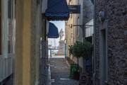 Step out of your apartment complex, and a short walk away is this charming side street which will take you straight into the heart of the harbour.