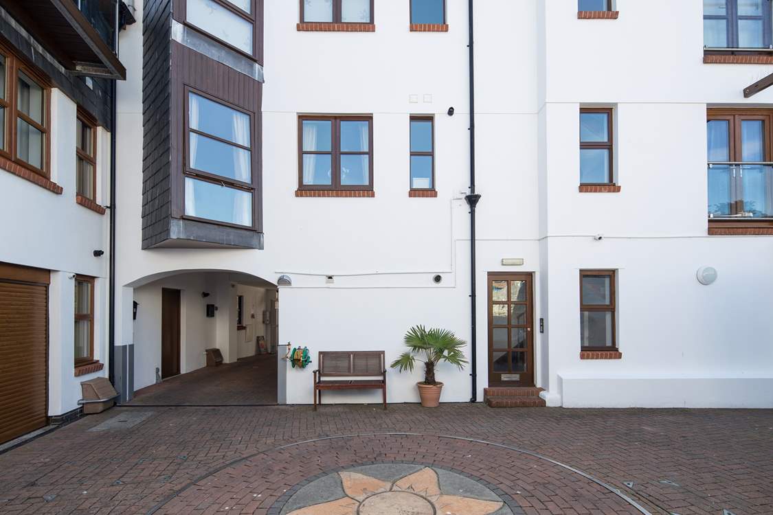 1 Pump Street Mews is accessed by the door to the right of the bench.