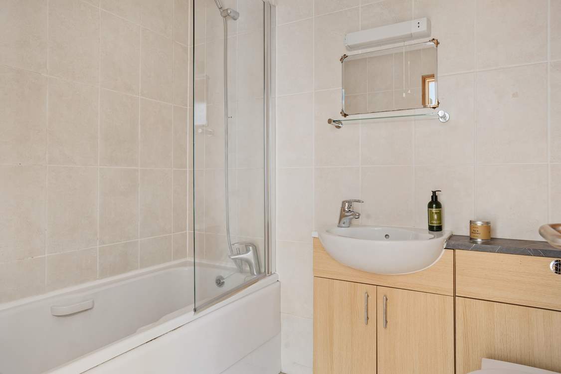 The family bathroom is ready to wash away the day's sand and sun cream.