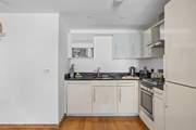 The kitchen is neatly tucked away, yet positioned perfectly so that chef is still part of the group when whipping up a feast.