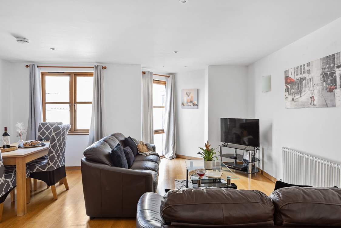The open plan living-room provides plenty of space for four guests.