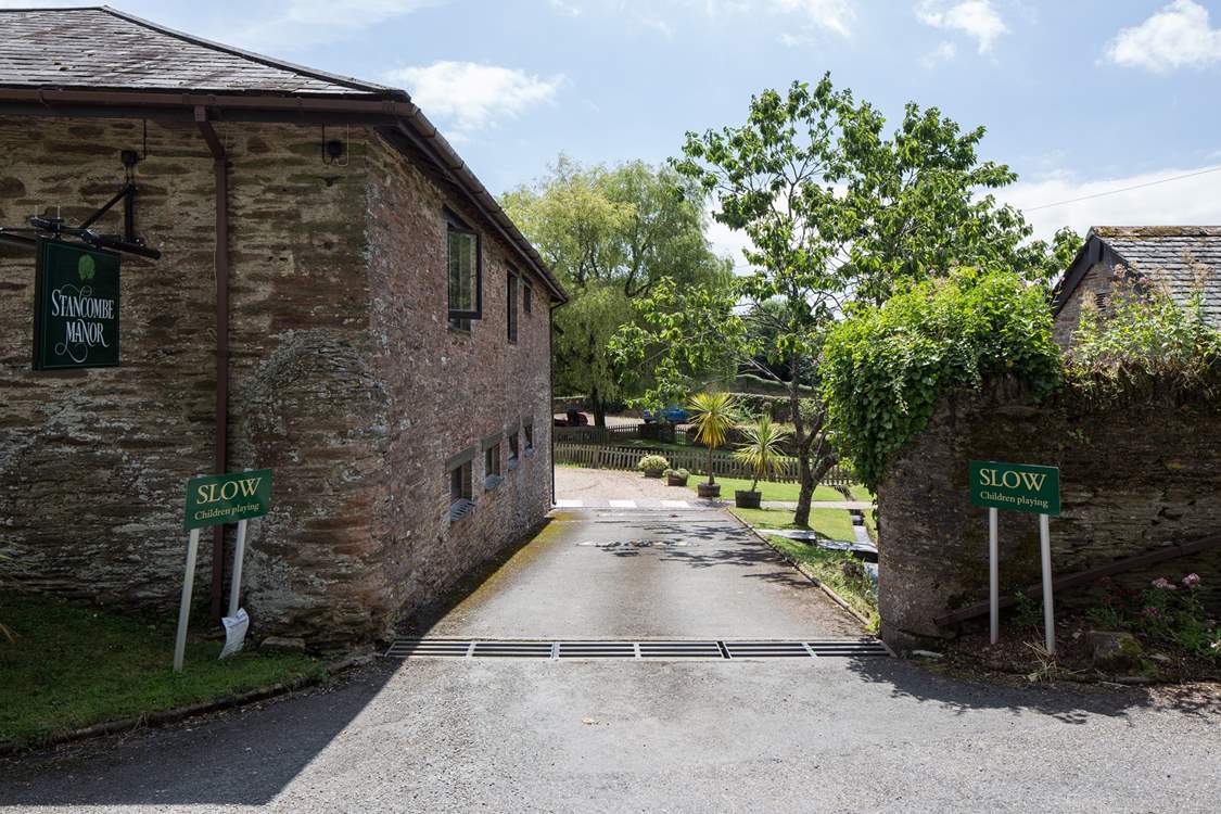 As you enter Stancombe Manor, the car parking area is directly in front of you, with Foxglove 25 yards to the left.