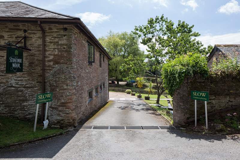 As you enter Stancombe Manor, the car parking area is directly in front of you, with Foxglove 25 yards to the left.