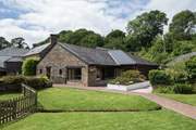 The swimming pool can be found in this lovely building.