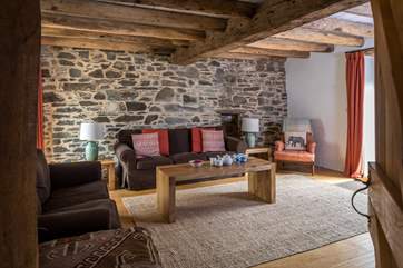 What a delightful sitting-room with plenty comfy seating for all.