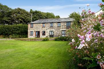 Coombe Cottage is located on the right-hand side and has its own private entrance and gorgeous garden at the back.
