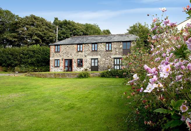 Coombe Cottage is located on the right-hand side and has its own private entrance and gorgeous garden at the back.