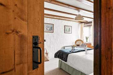 The peaceful double bedroom is on the ground floor.