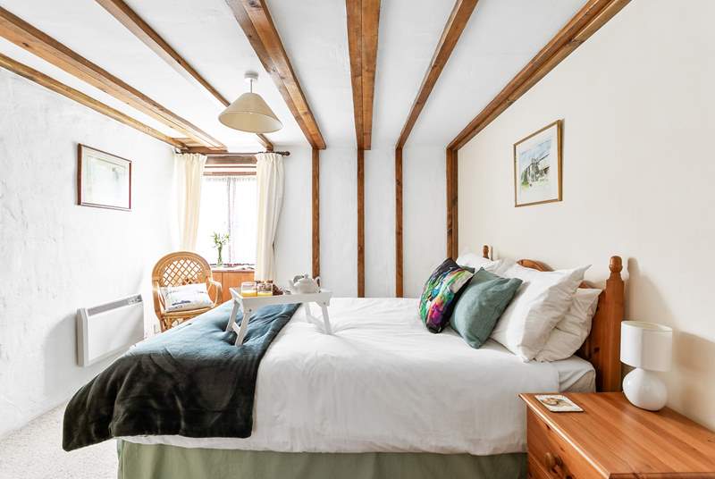 With gorgeous linens and characterful beams.
