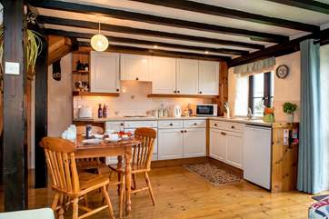 The kitchen is well-equipped and has ample storage space.
