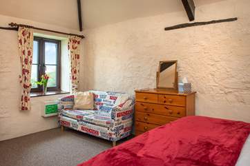 The bedroom even has a small sofa on which you can relax.