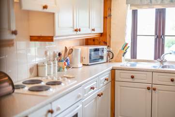 The kitchen is well-equipped and has ample storage space.