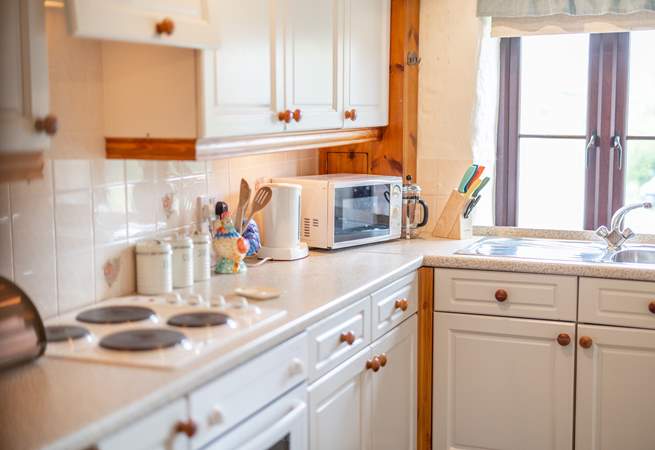 The kitchen is well-equipped and has ample storage space.