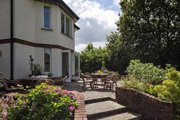 Imagine sitting out on this beautiful terrace with the morning paper watching the younger members of the party run wild in the beautifully maintained lawn. The perfect way to start the day.
