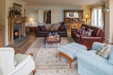 This beautiful room provides the perfect area to gather and relax in style, luxury and ultimate comfort. The warming wood-burner perfects the scene.