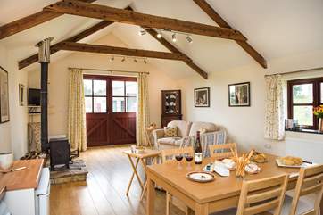 The open plan living-room is comfortably furnished and is very spacious.