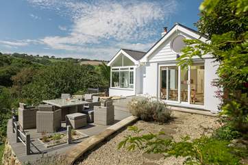 The extensive deck area acts as an outdoor sitting-room.