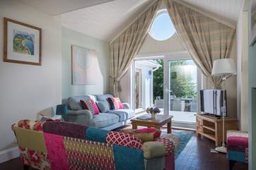 The sitting-room has patio doors onto the deck.