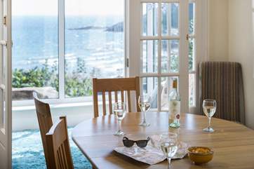 The dining-area looks through to the sun-room.