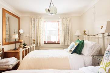 The twin bedroom looks into the private courtyard on the ground floor (Bedroom 1).