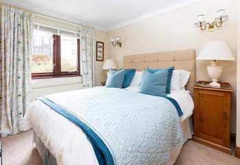 The principle bedroom oozes comfort. 