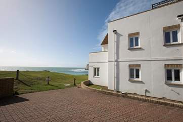 There is convenient outside space for one car, as well as garage space for a smaller car.