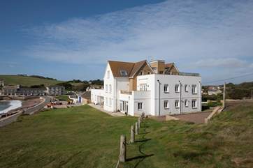 A stunning building surrounded by fantastic scenery.