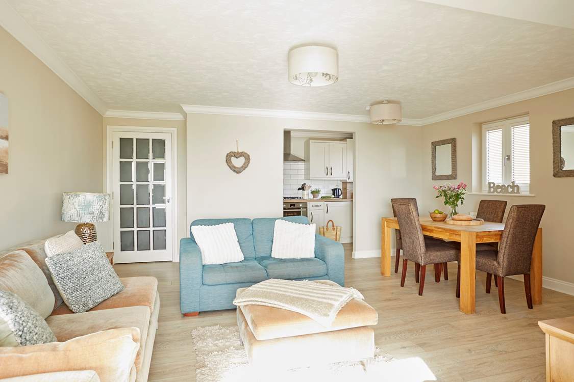 The bright, beautiful living area offers a welcoming space for the whole family.