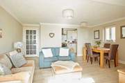 The bright, beautiful living area offers a welcoming space for the whole family.