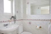 The en suite shower-room to the principal bedroom.