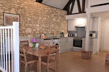 The open plan kitchen and dining-area has a modern fitted kitchen.
