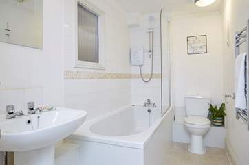 Modern bathroom with fitted shower.