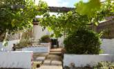 Access to the courtyard through the patio doors off the living area. - Thumbnail Image