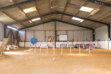 The nearby barn is used by the owners for dog agility training.